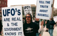 A group of protestors march in front of the General Accounting Office (GAO) to raise awarness about an examination being conducted by the GAO for documents about a weather balloon crash at Roswell, New Mexico in March 1947.